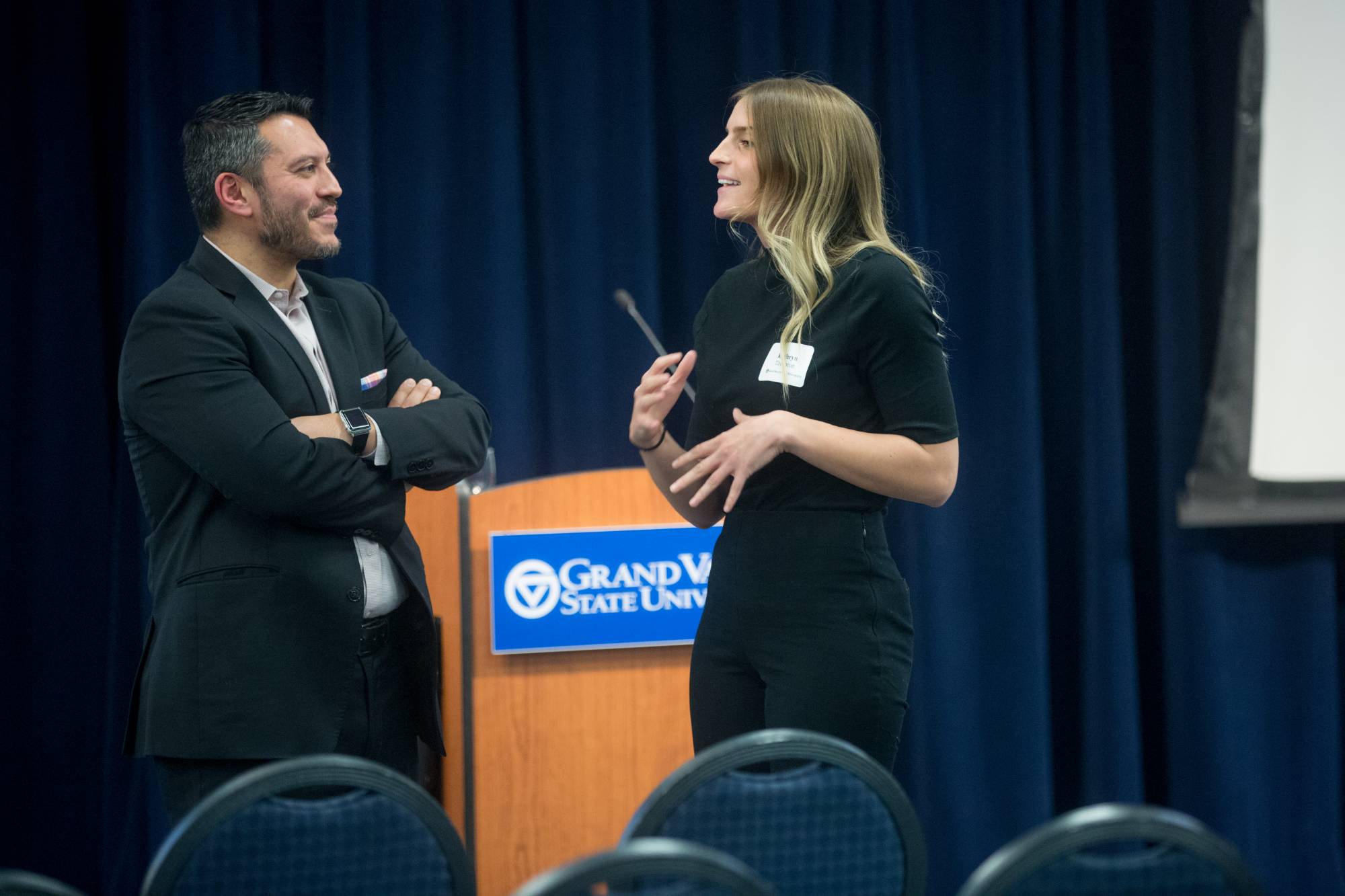 student speaking to keynote speaker after the event
